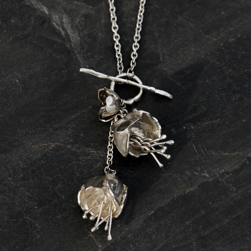 The Sterling silver Double Peony Flower Necklace is on a long 34 inch chain, with a T-bar at the front. it can be worn as a long necklace or doubled around to be worn as a stylish shorter necklace. 